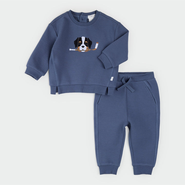 Petit Lem Rink Rover dark blue sweatshirt and jogger set with a Bernese Mountain Dog holding a hockey stick