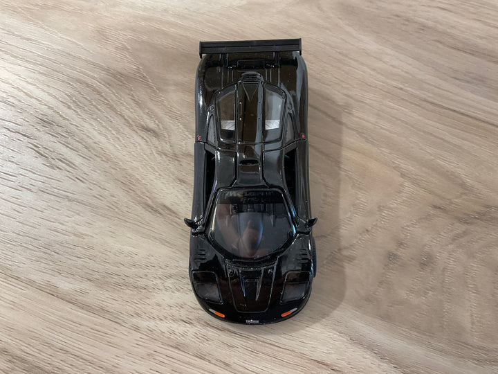 Black 1995 McLaren F1 GTR die-cast pull-back car