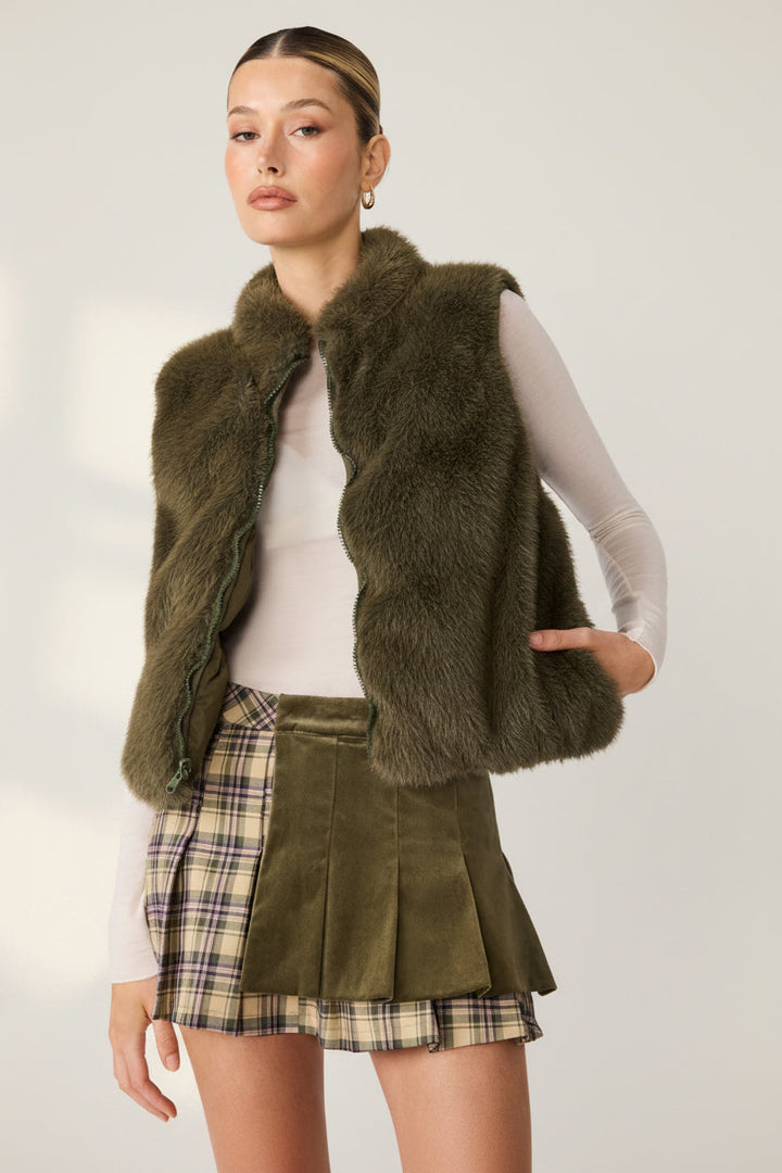 Steve Madden Brady Vest in Dark Olive, showing the faux fur side and front zipper