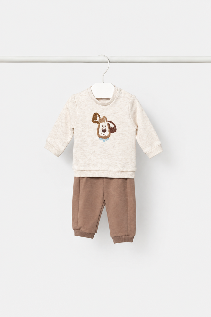 Cream puppy-print knit outfit alone on hanger
