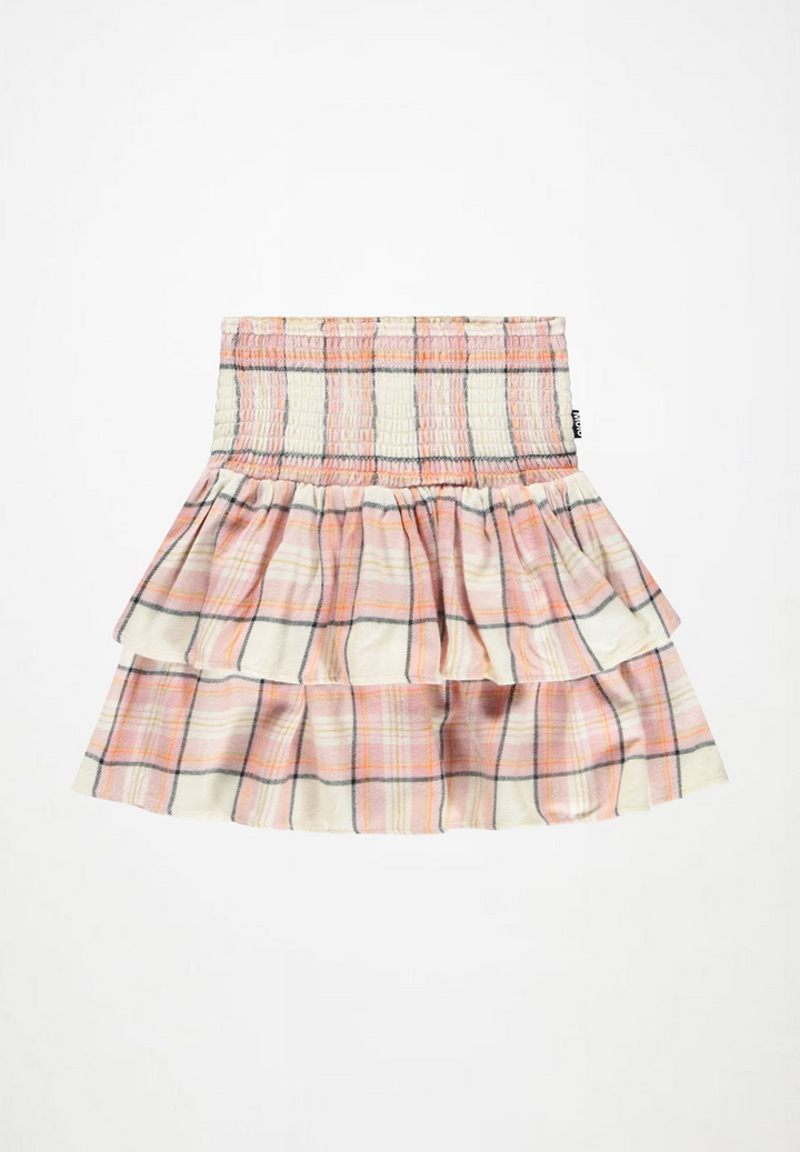 A tiered ruffle mini skirt with a plaid pattern in cream, pink, and orange, featuring a smocked waistband.