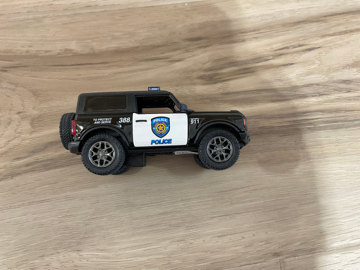 Black and white 2022 Ford Bronco police die-cast vehicle