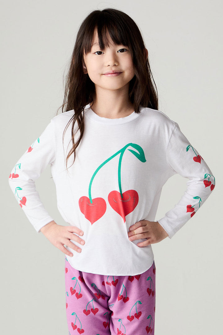 Front view of a girl wearing the Chaser Sweethearts Girls Tee on a neutral background with matching pink pants; top only, coordinating bottoms sold separately