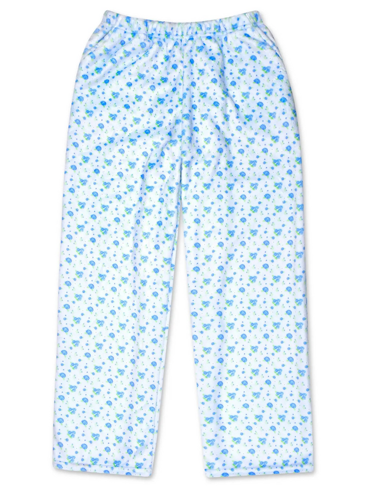 White children's pajama pants with a blue and light blue floral pattern, featuring an elastic waistband and side pockets.