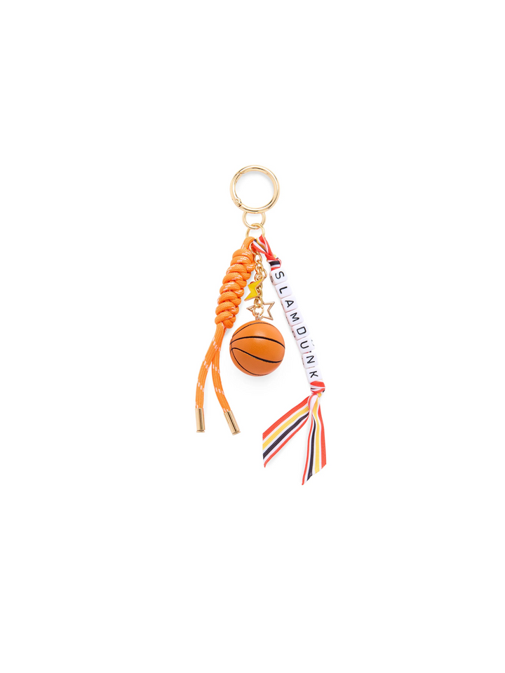 A basketball-themed keychain charm featuring a small orange basketball charm, braided orange cord, a white ribbon with 'ISLAND DUNK' text, and a gold-tone key ring on a plain white background.