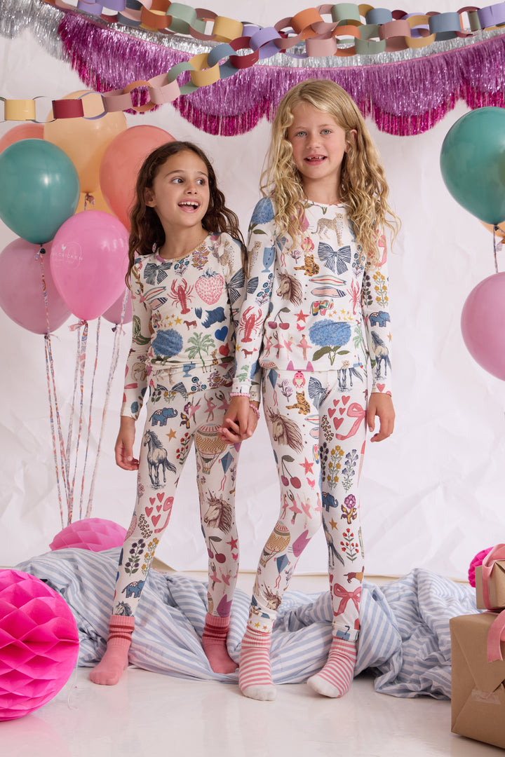 Children wearing Pink Chicken 20 Years of PC White bamboo pajamas